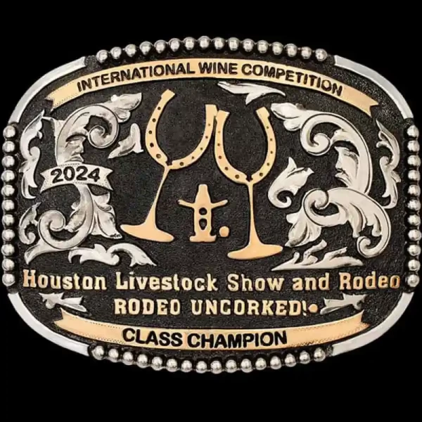 "Raise your glass to good times and great company! Our Napa Belt Buckle is hand-engraved on a German Silver base, featuring our beaded edge on all four sides and is overlaid with western-inspired scrolls. Jeweler's Bronze banners frame the top and bo